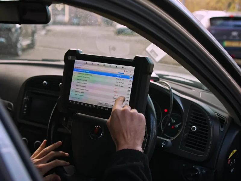 Diagnostic tablet held in the cab during an OBD session